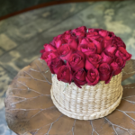 Ava | 25 red rose flat-lay in woven cane